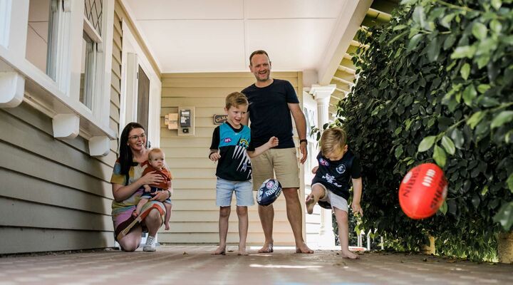 Buck Family Kicking Football Around