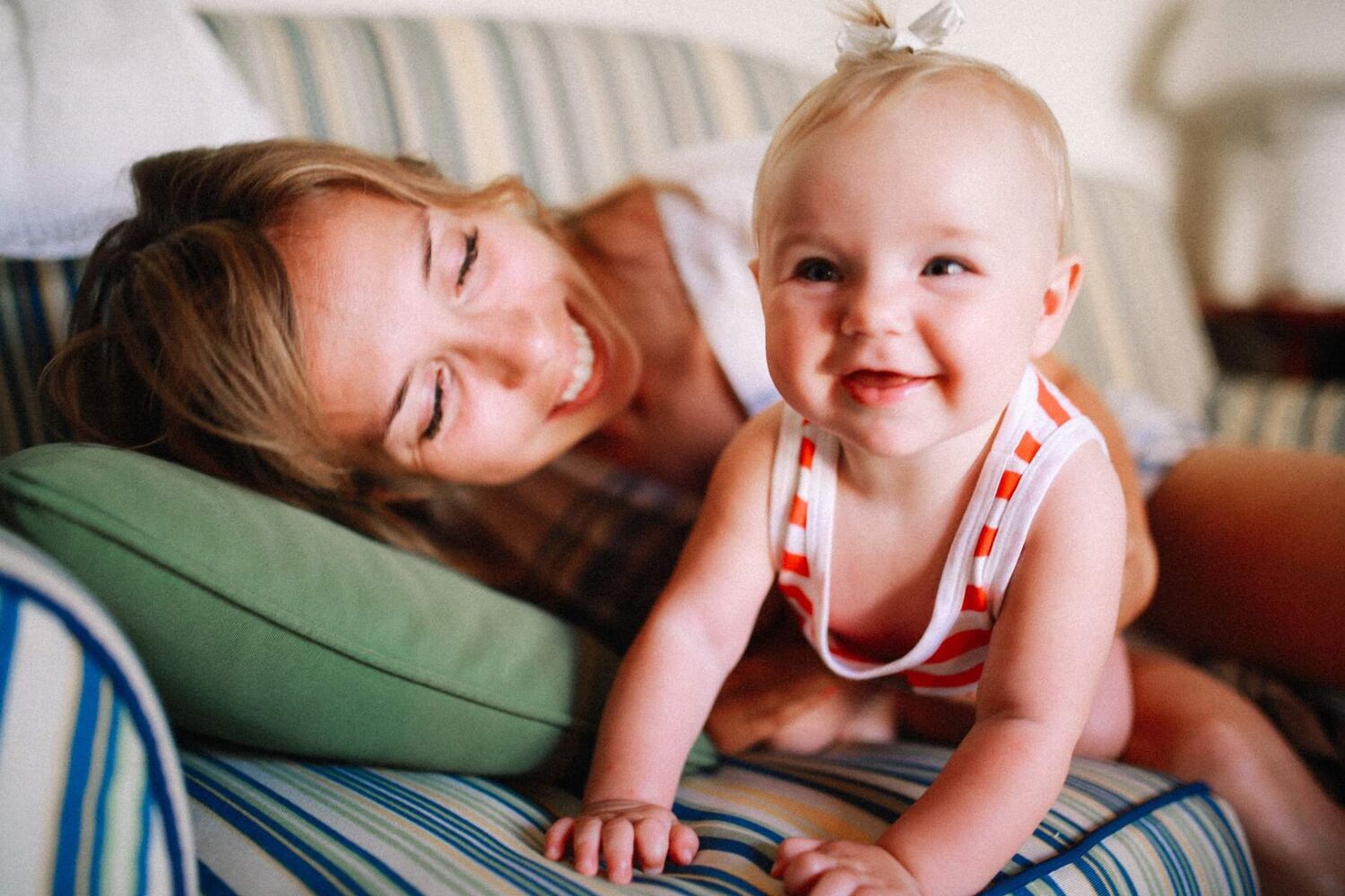 Mother With Baby On Couch